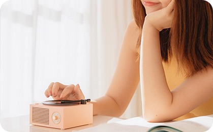 Smiling woman unboxing a package box at home after online shopping